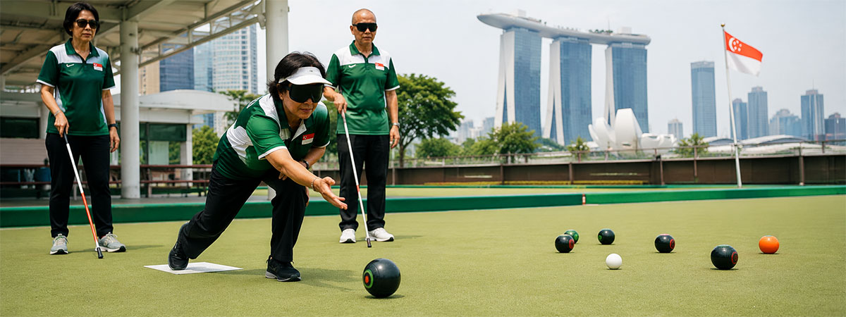 A visually impaired lawn ball player delivers a bowl on a Singapore green while teammates provide guidance and support.
